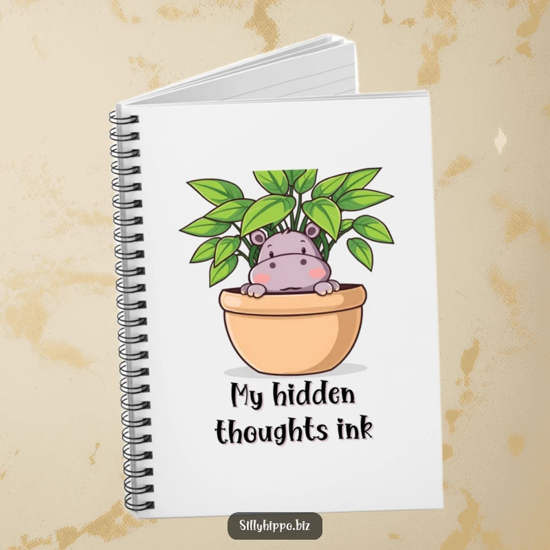 Funny Notebook cover showing a playful hippo peeking out from behind a large potted plant, perfect for notes.