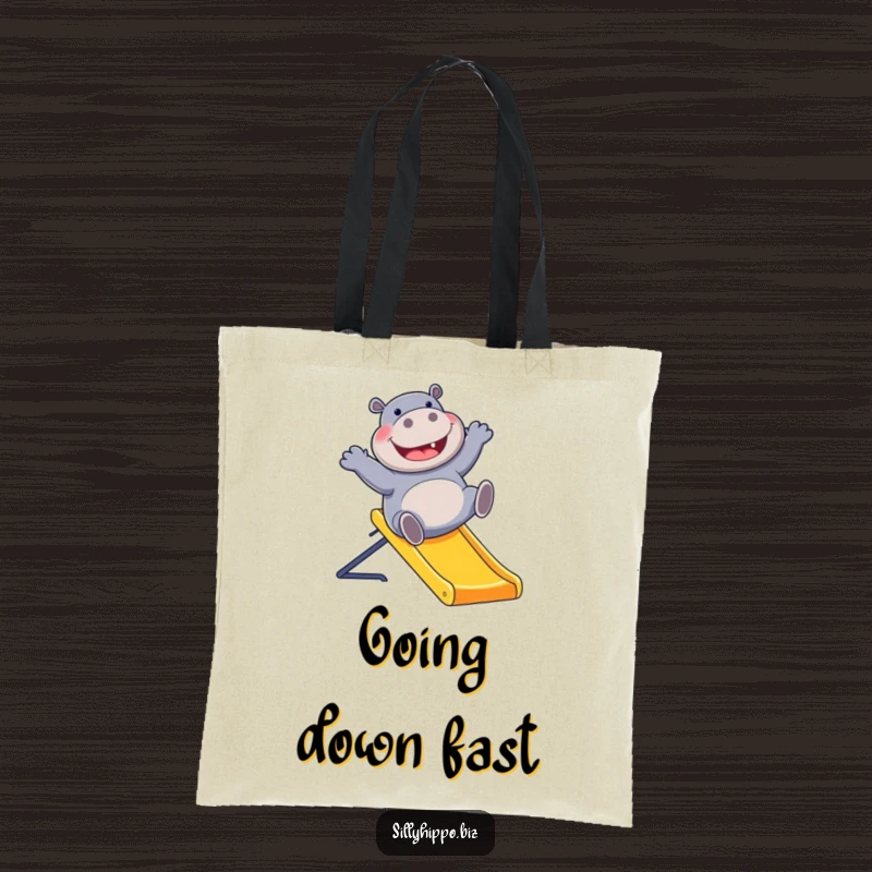 Funny tote bag with a delighted hippo sliding down a vibrant office slide, showcasing a fun and whimsical attitude for everyday use.
